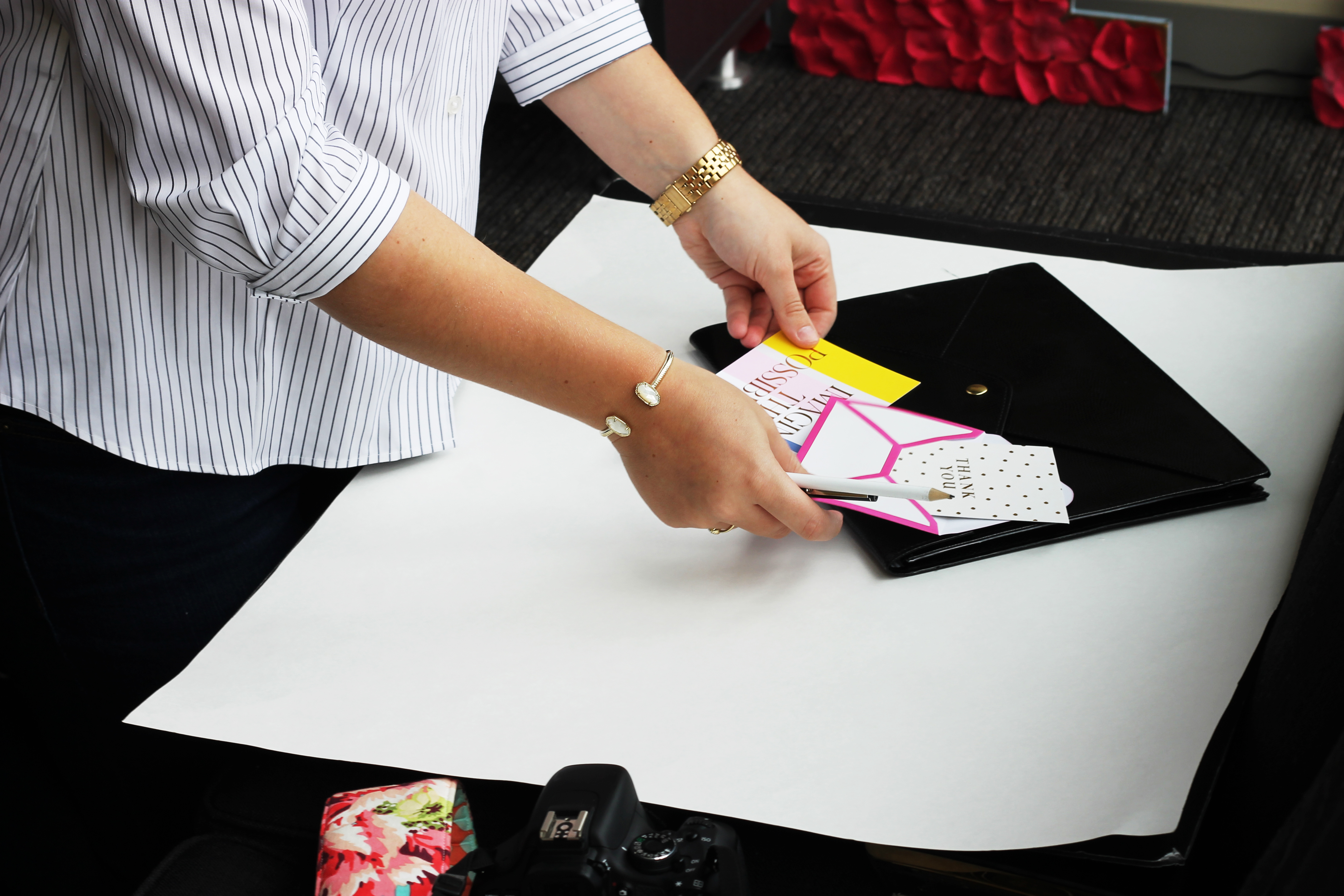 She owns plain-colored posterboards to get that clean, sleek background for her shots.