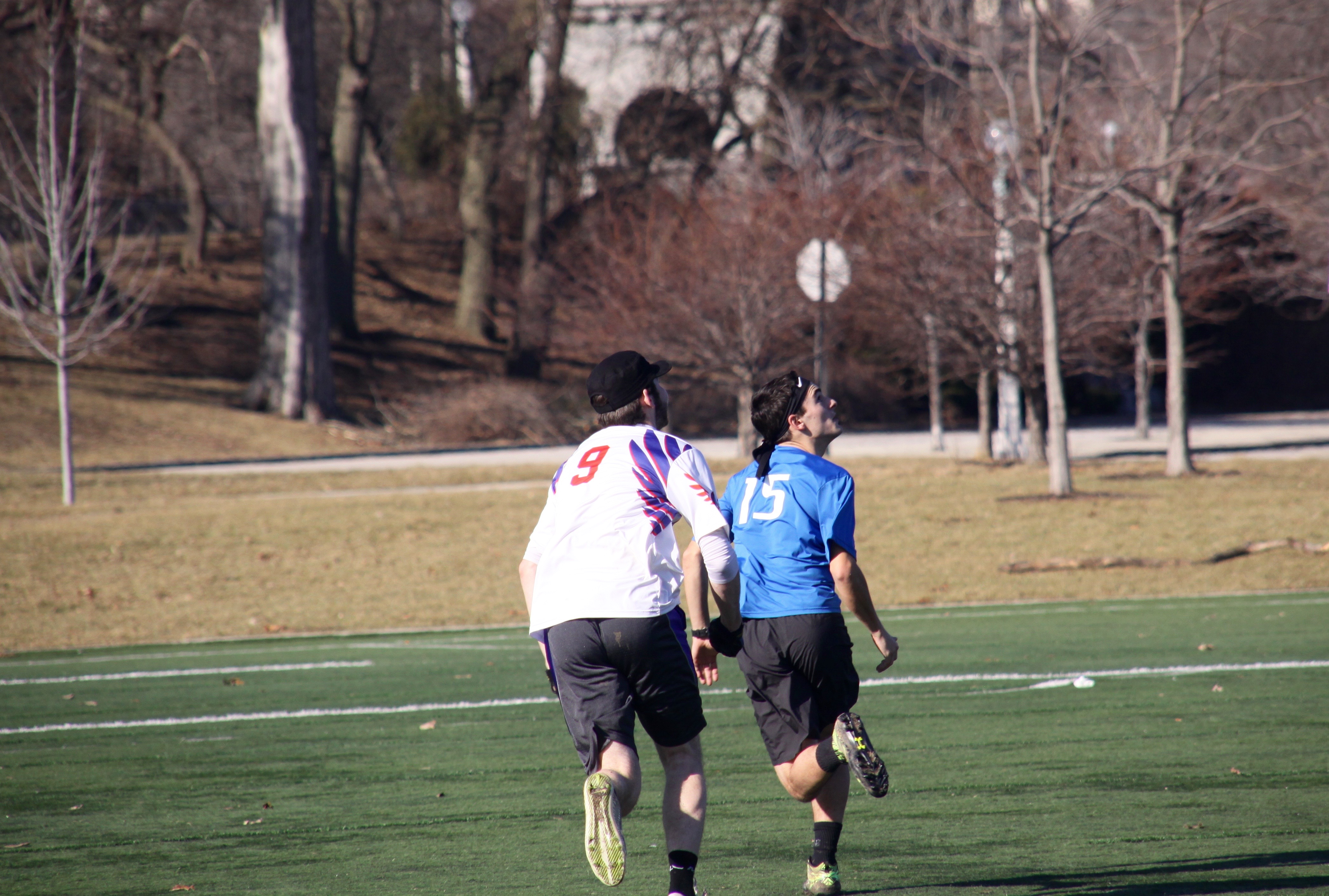 Josh Ludke chases Eric Swan as both players try to win the disc during a DePaul Ultimate Club practice on Jan. 21, 2017. (Photo/Ben Rains)