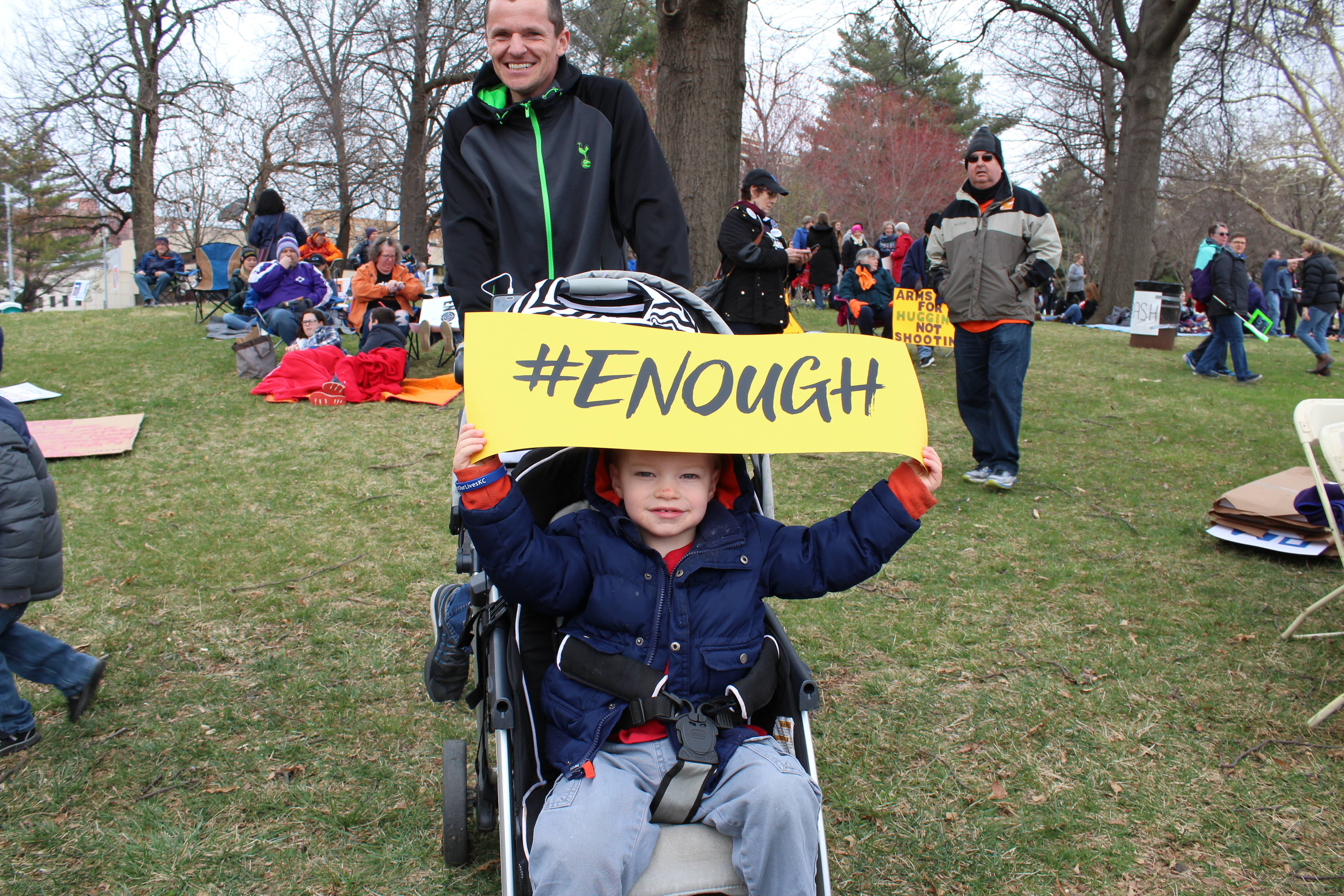 Daniel, strapped in his stroller, held a sign with the popular hashtag that came up after the Parkland, Florida shooting. His father, who was tasked with pushing him around in his stroller, said Daniel had grabbed the sign from a table that was set up by organizers of March for Our Lives Kansas City. Photo: Carina Smith, 14 East.