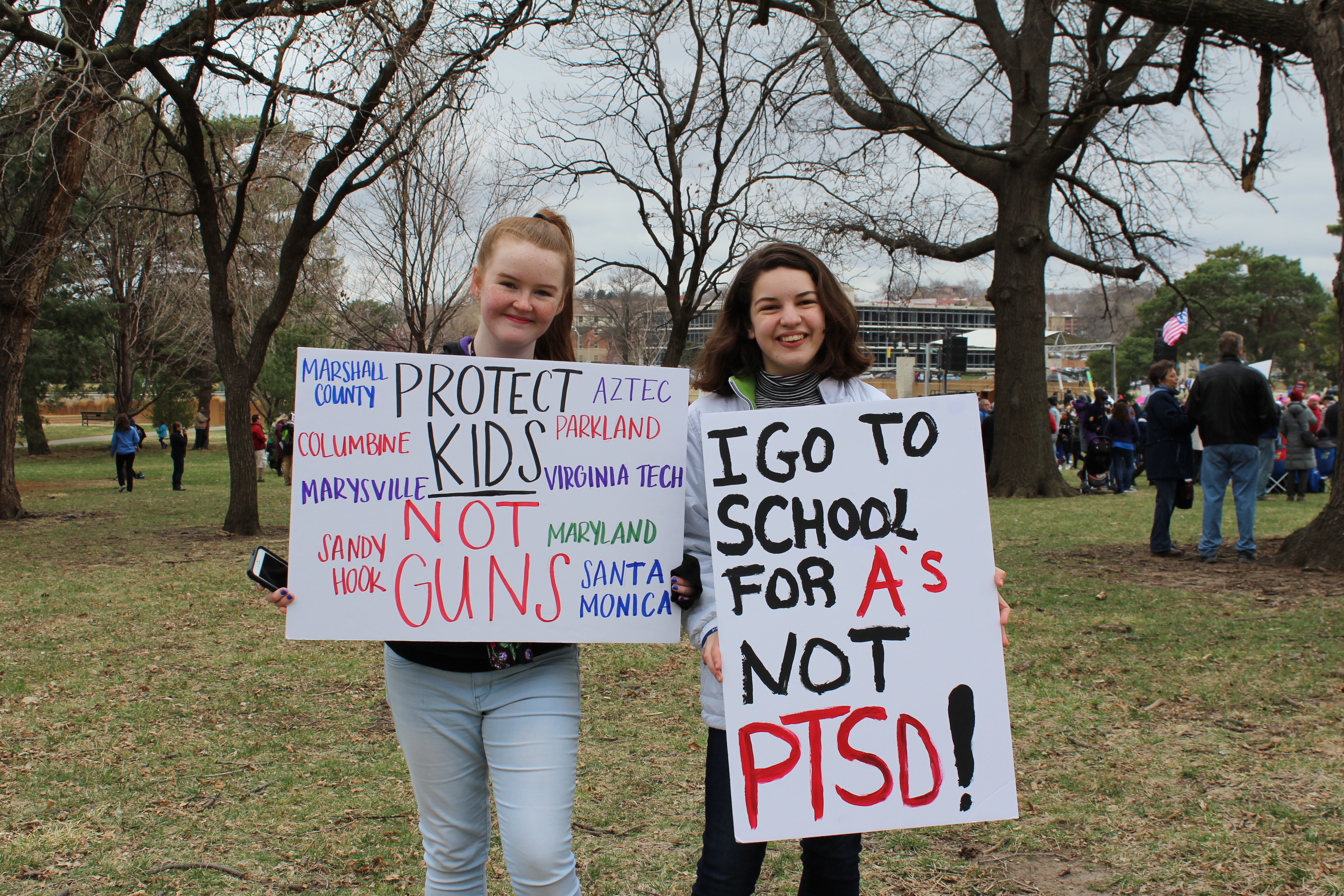 Two high school students, Claire and Gabriella, drove hours to be at the march in Kansas City. Many local high school students had taken initiative to put together the event, and the two wanted to be a part of the historic moment. “I just think the (Shawnee Mission) East kids are fantastic for even wanting to put it together,” Gabrielle said. Photo: Carina Smith, 14 East.