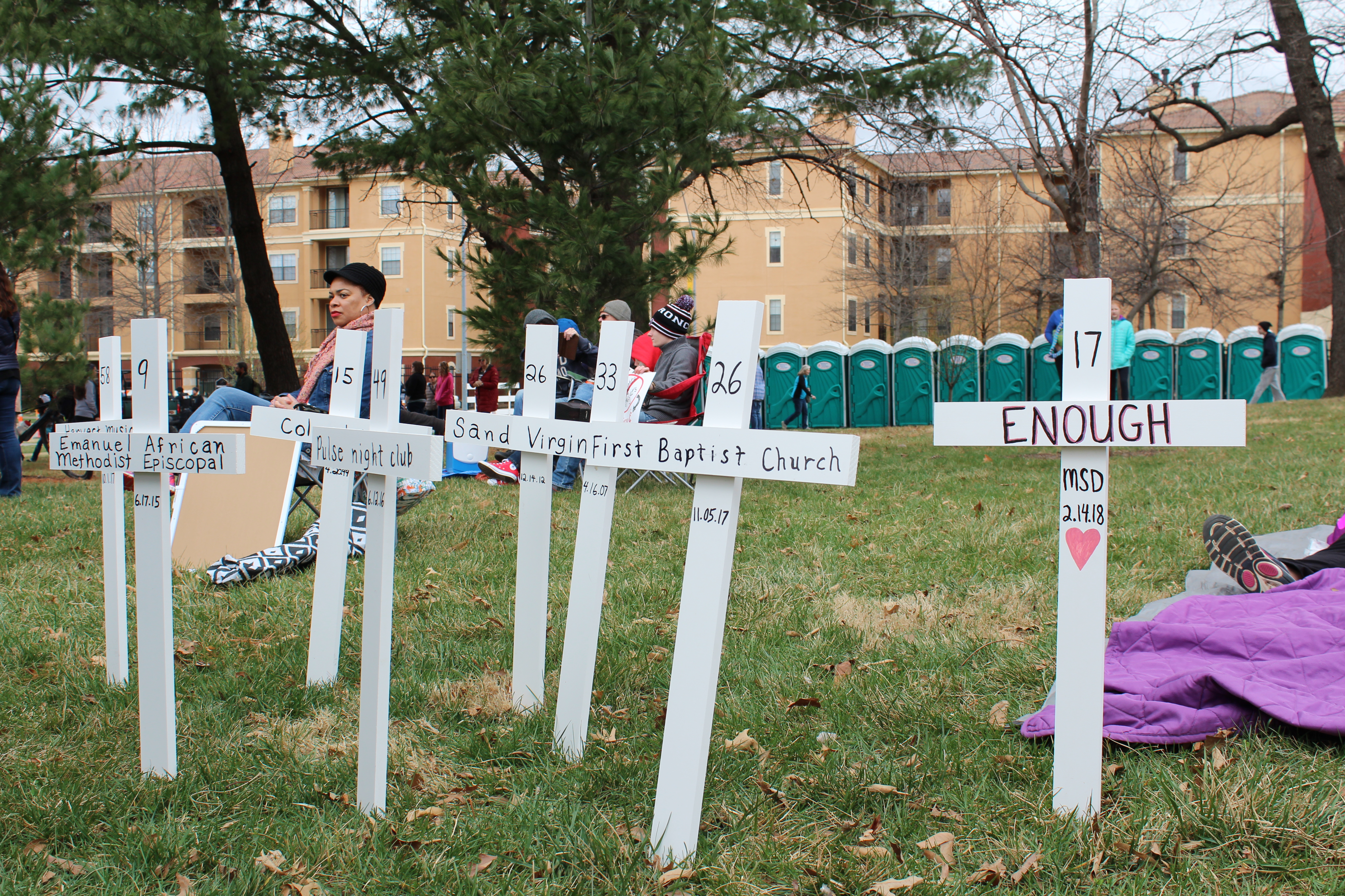 White crosses stick out on the outskirts of the protest in Kansas City, Missouri. Each one symbolized some of the worst mass shootings that have happened in U.S. history, such as Columbine and Pulse nightclub. The dates of each shooting were written directly beneath each shooting, and many protesters stood to stare at the crosses in silence. Photo: Carina Smith, 14 East.