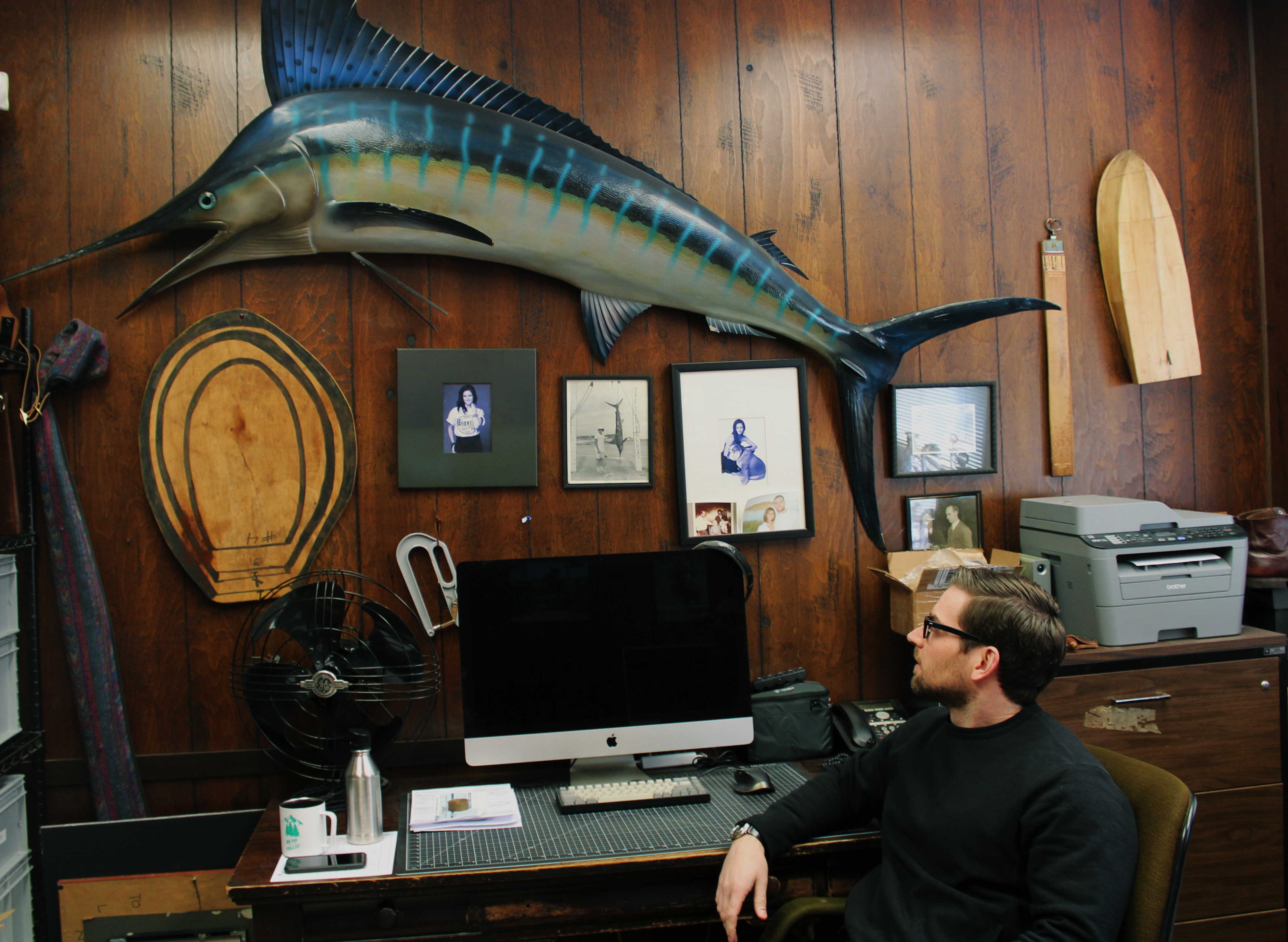 Nick Horween sits at his great-grandfather's desk, looking at the giant marlin displayed on the dark wood-plated wall. (Sarah Julien, 14 East)